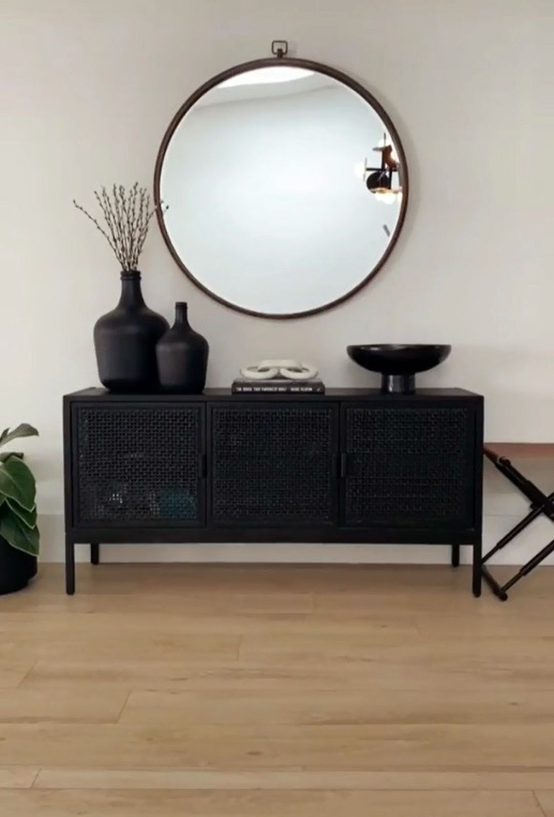 All Black Decoration On Console Table